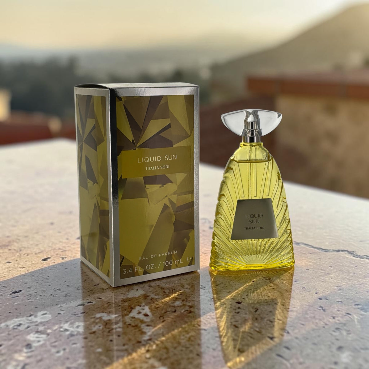 "Liquid Sun by Thalia Sodi for women, amber floral perfume with neroli and coconut"