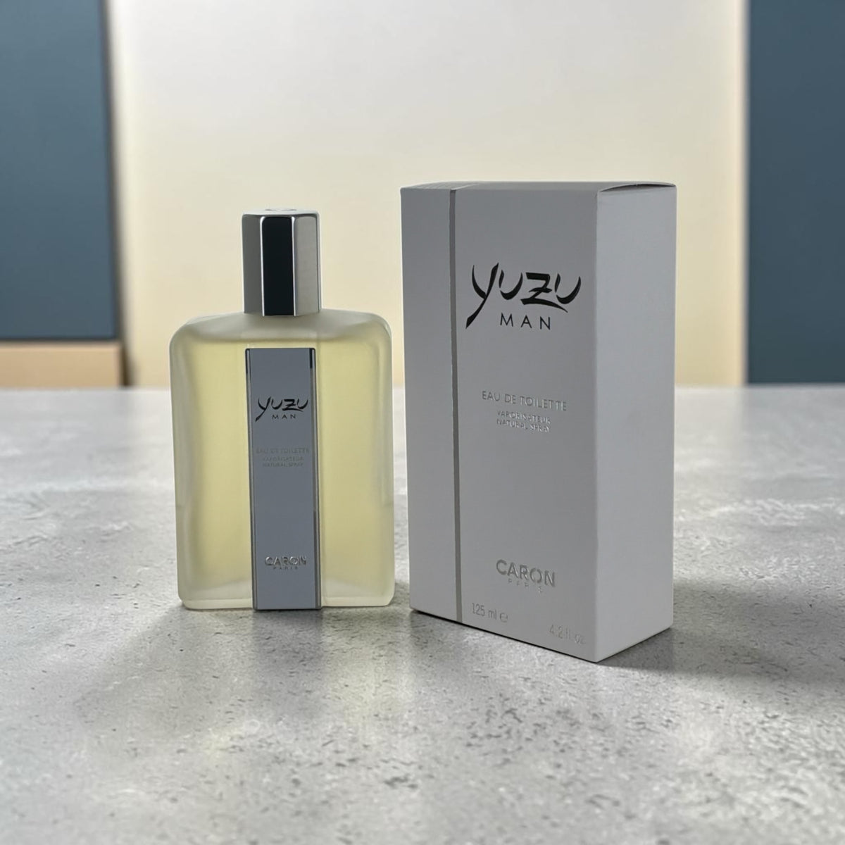 "Caron Yuzu Man cologne for men with yuzu, bergamot and cedar notes, front view of the bottle"